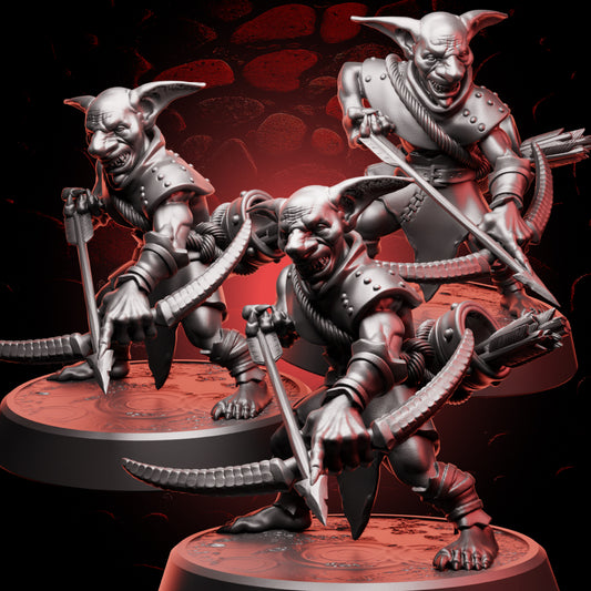 Three 32mm scale goblin archers in  leather armor with bows at the ready