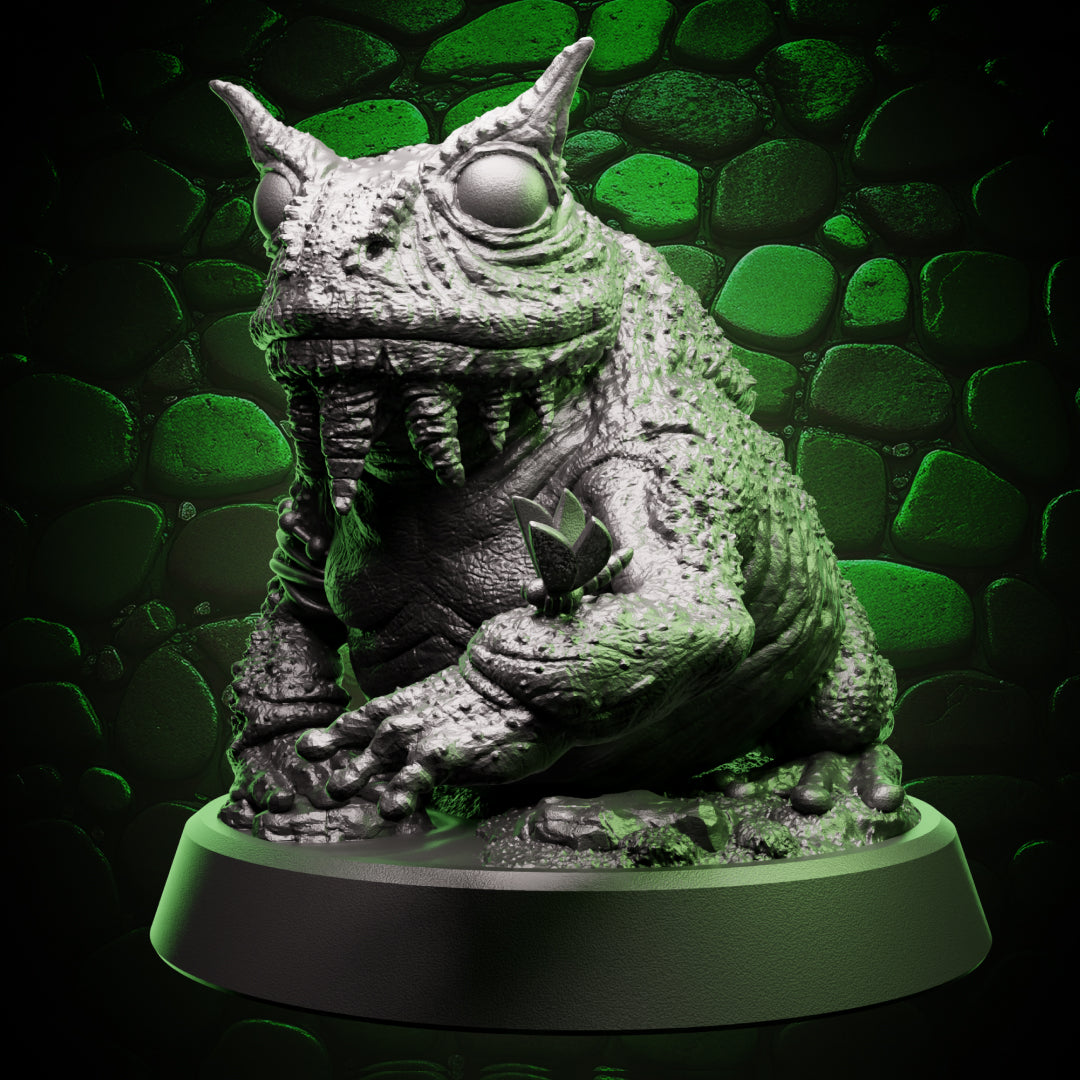 Front view of giant toad familiar miniature with wide eyes, textured skin, and seated stance – fantasy RPG resin mini.