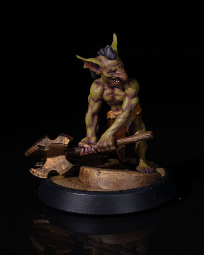 Painted Goblin Fighter miniature with attack pose, crude mace, and loincloth