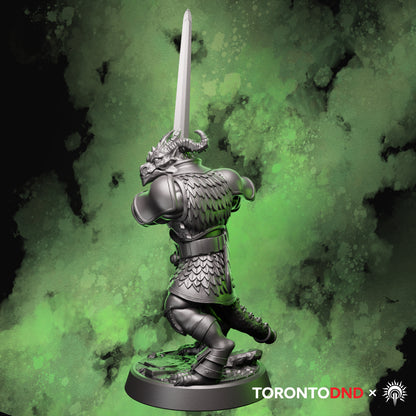 Left side view of a Dragonborn Fighter miniature showing layered armor, tail, and sword alignment