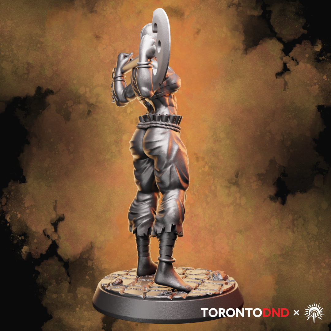 Left side view of a Goliath Barbarian miniature emphasizing the axe head shape, arm tension, and grounded stance