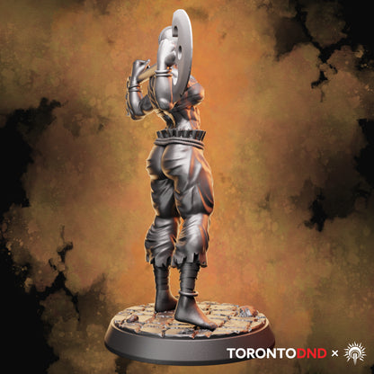 Left side view of a Goliath Barbarian miniature emphasizing the axe head shape, arm tension, and grounded stance
