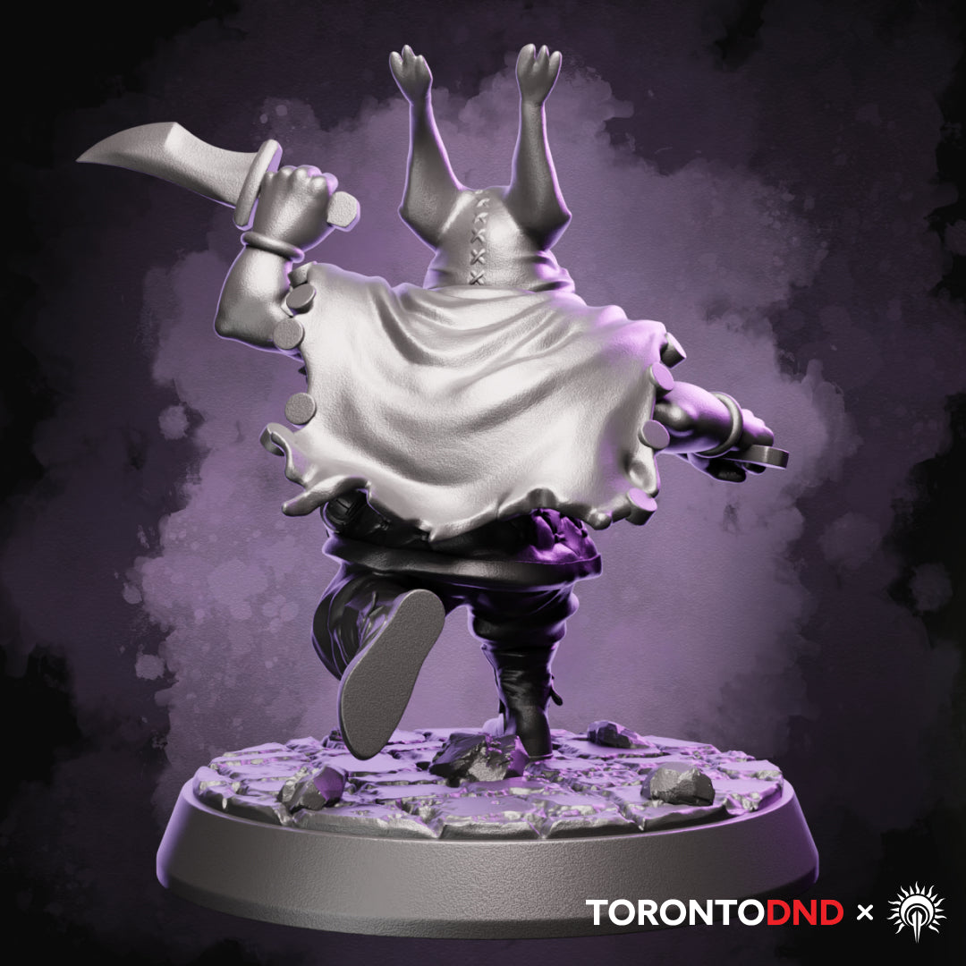 Rear view of a high-quality resin Halfling Rogue miniature showing flowing cloak, gear straps, and running pose details