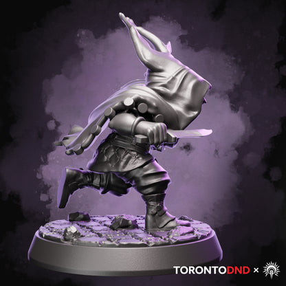 Right side view of a high-quality resin Halfling Rogue miniature emphasizing weapon angles and dynamic running posture