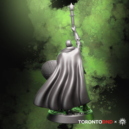 Rear view of a high-quality resin tabletop miniature focusing on the Human Cleric’s flowing cloak, shield back, and base details. Rendered preview of the sculpt.