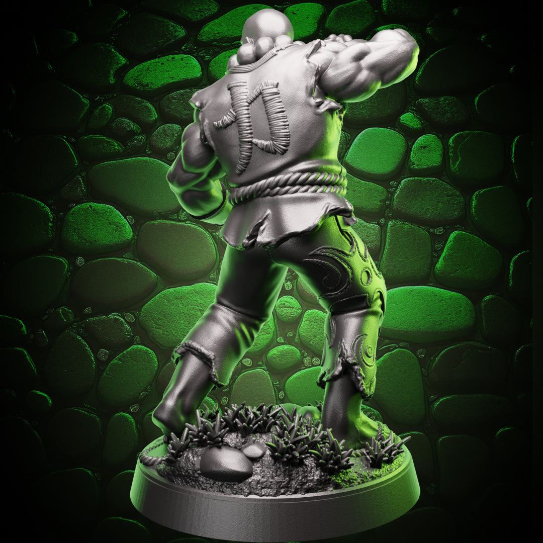 Back view of the Human Monk Stonefist miniature showing the stitched symbol on his gi, rope belt, and the detailed rocky terrain on the base.