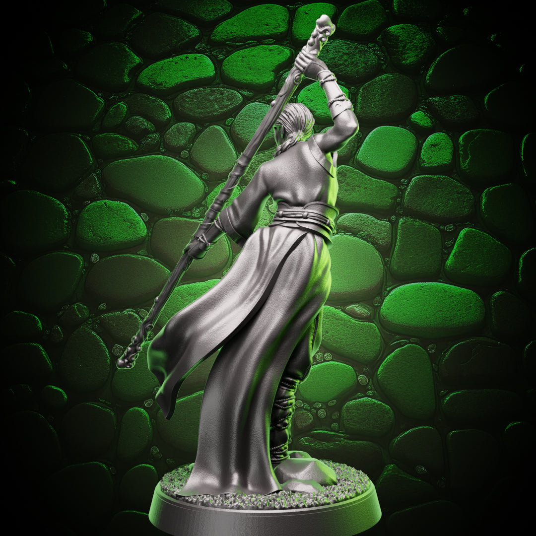 Back view of human monk quarterstaff fighter showing robe drape, tied sash, and staff grip detail