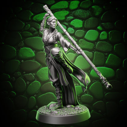 Front view of human monk miniature holding a quarterstaff, flowing robes and wrapped bindings for fantasy RPGs