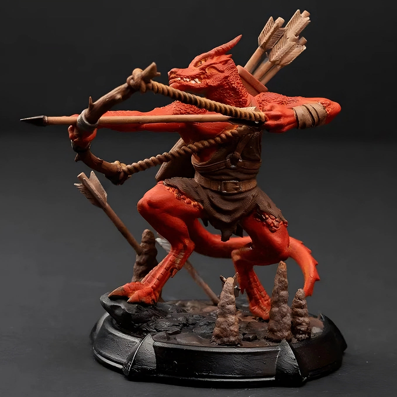 Front view of painted red Kobold Archer miniature showing its red scales, brown quiver, and archer stance, perfect for painting and gameplay. Ready for the table!