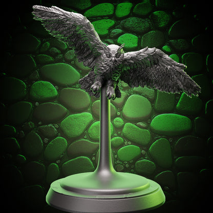 Wide front view of Owl Familiar miniature in mid-flight with wings outstretched and talons ready.