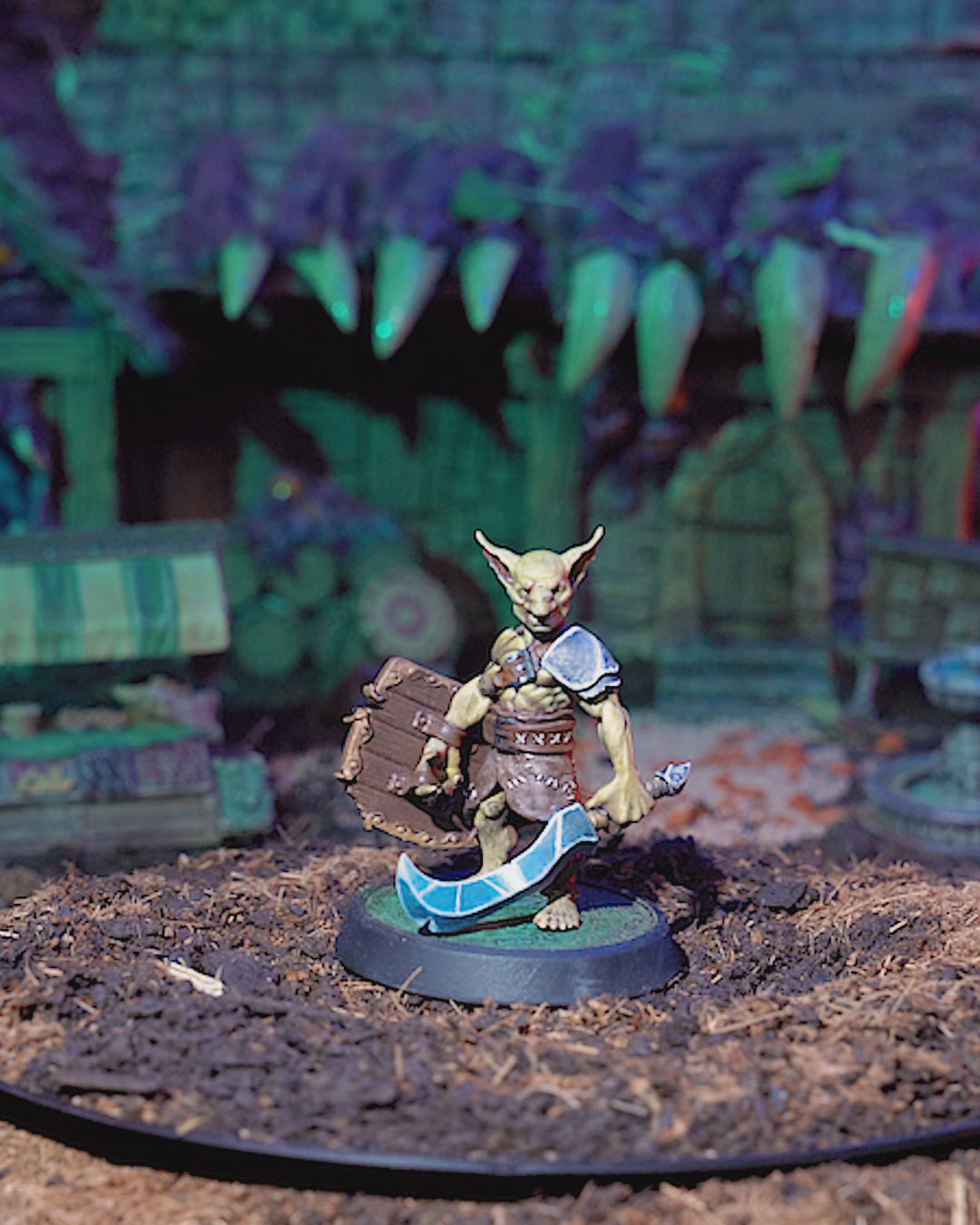 360-degree view of painted Goblin Fighter miniature with dynamic pose, detailed armor, and expressive goblin features.