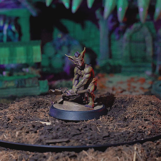 360-degree view of painted Goblin Fighter miniature with attack pose, crude mace, and loincloth