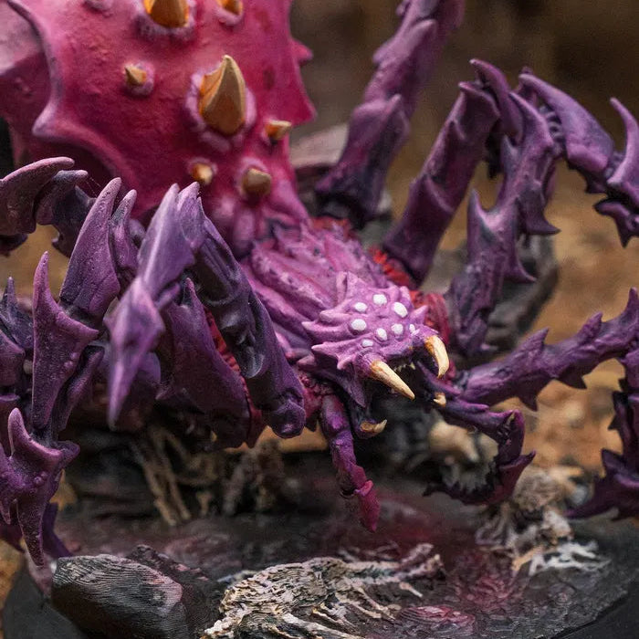 Close-up of Spider Colossus D&D miniature showing fangs, eyes, and spiked carapace