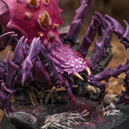 Close-up of Spider Colossus D&D miniature showing fangs, eyes, and spiked carapace