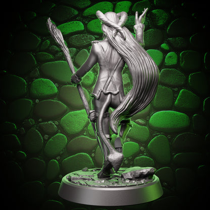 Back view of tiefling sorcerer mini figure showing long hair, tail, jacket seams, and staff held behind the body